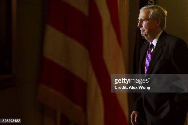 Senate Majority Leader Sen. Mitch McConnell walks back to his office after he speaking to members of the media at the Capitol August 1, 2017 in...