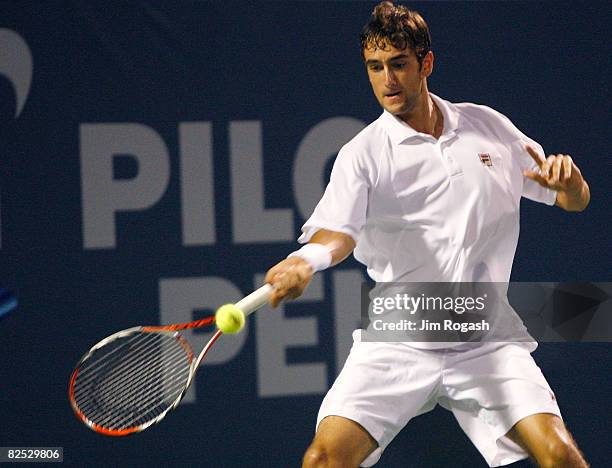 Marin Cilic of Croatia returns to Mardy Fish of the United States during Day 6 of Pilot Pen Tennis on August 23, 2008 at Connecticut Tennis Center in...