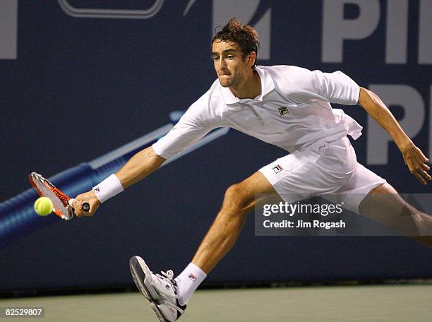 Marin Cilic of Croatia returns to Mardy Fish of the United States during Day 6 of Pilot Pen Tennis on August 23, 2008 at Connecticut Tennis Center in...