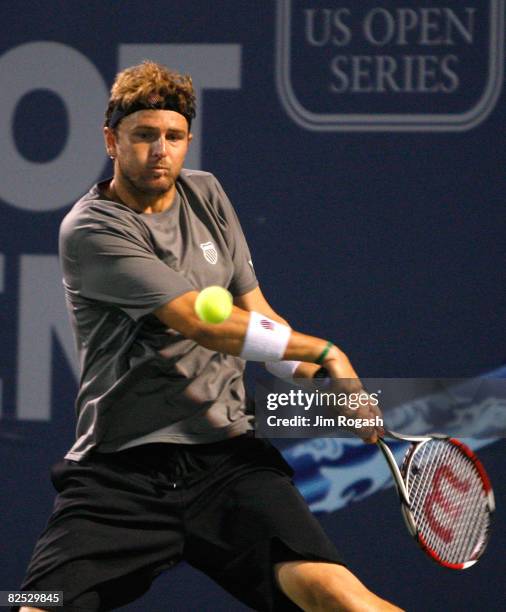 Mardy Fish of the United States returns to Marin Cilic of Croatia during Day 6 of Pilot Pen Tennis on August 23, 2008 at Connecticut Tennis Center in...