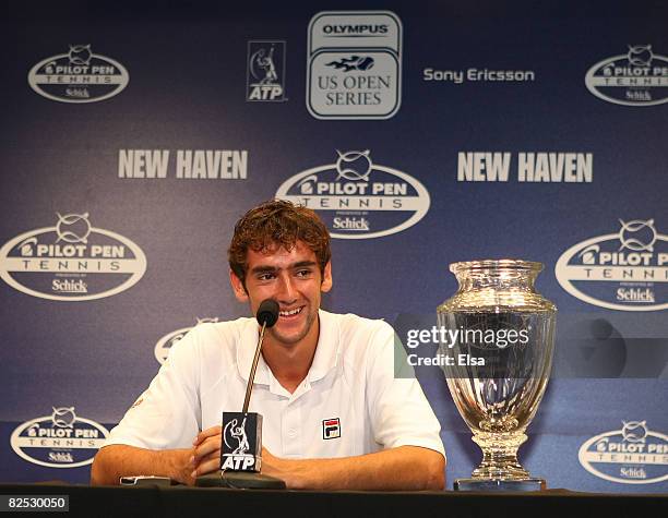 Marin Cilic of Croatia answers questions at a press conference after his match win over Mardy Fish in the men's singles championship match during Day...