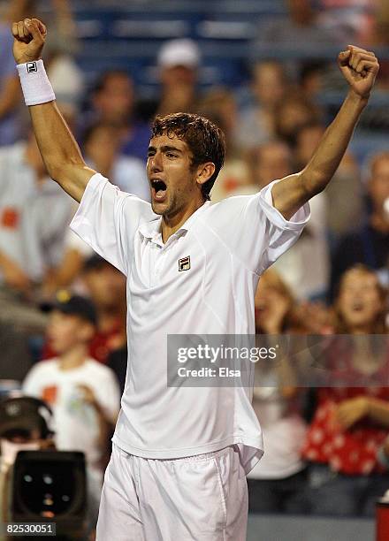 Marin Cilic of Croatia celebrates his match win over Mardy Fish in the men's singles championship match during Day 6 of Pilot Pen Tennis on August...