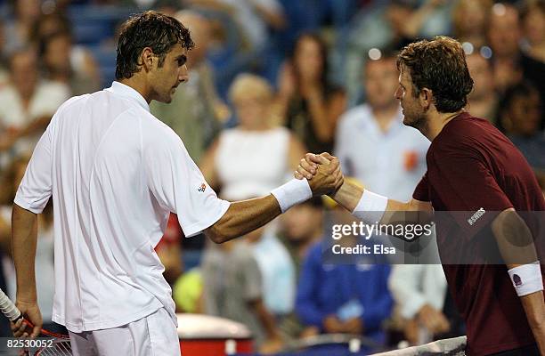 Marin Cilic of Croatia congratulated by Mardy Fish after the men's singles championship match during Day 6 of Pilot Pen Tennis on August 23, 2008 at...