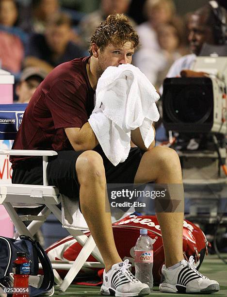 Mardy Fish sits after the men's singles championship match during Day 6 of Pilot Pen Tennis on August 23, 2008 at the Connecticut Tennis Center in...
