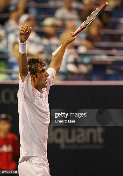 Marin Cilic of Croatia celebrates his match win over Mardy Fish in the men's singles championship match during Day 6 of Pilot Pen Tennis on August...