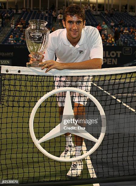 Marin Cilic of Croatia poses with his trophy after his match win over Mardy Fish in the men's singles championship match during Day 6 of Pilot Pen...