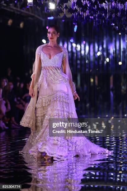 Model walks on the ramp showing creations made by designer Manish Malhotra during the India Couture Week 2017 on July 30, 2017 in New Delhi, India.