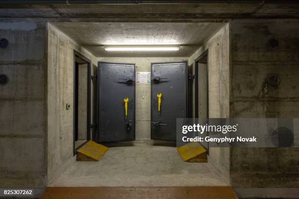 bomb shelters in building basement - shelter stock-fotos und bilder