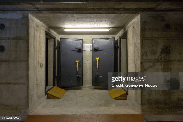 bomb shelters in building basement - bunker stockfoto's en -beelden