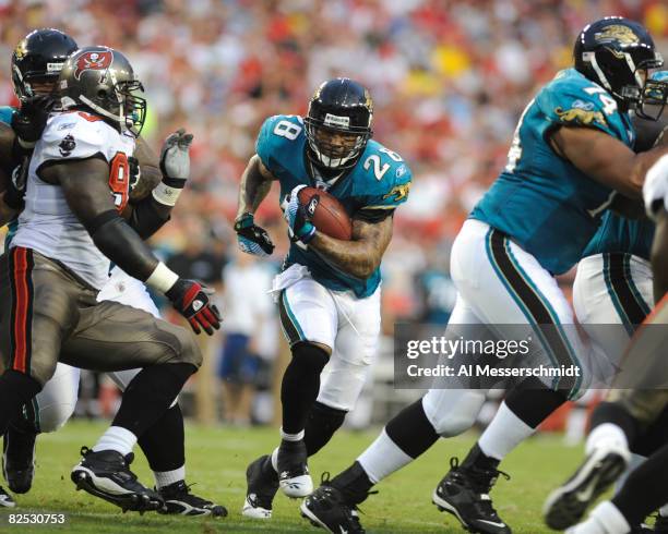 Running back Fred Taylor of the Jacksonville Jaguars rushes upfield against the Tampa Bay Buccaneers at Raymond James Stadium on August 23, 2008 in...