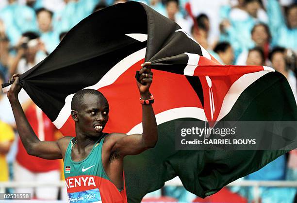 Kenya's Sammy Wanjiru celebrates after winning the men's marathon at the "Bird's Nest" National Stadium during the 2008 Beijing Olympic Games on...