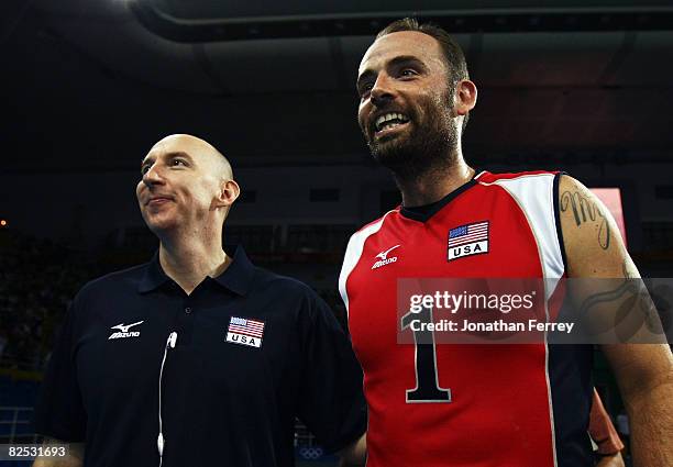 United States Men's indoor volleyball head coach Hugh McCutcheon celebrates with Lloy Ball of the United States after the Gold Medal volleyball match...
