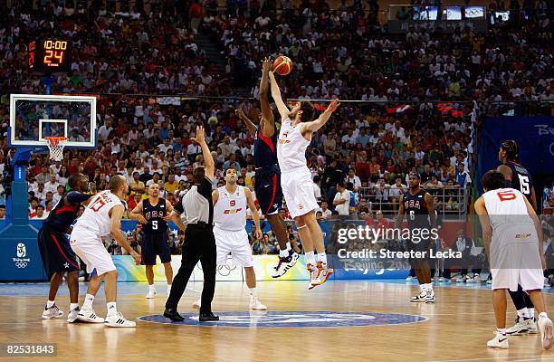 Pau Gasol of Spain and Dwight Howard of the United States leap for the jump ball to start the gold medal game during Day 16 of the Beijing 2008...