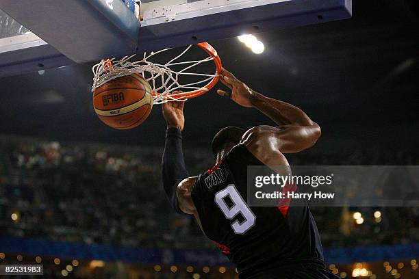 Dwyane Wade of the United States slam dunks in the gold medal game against Spain during Day 16 of the Beijing 2008 Olympic Games at the Beijing...