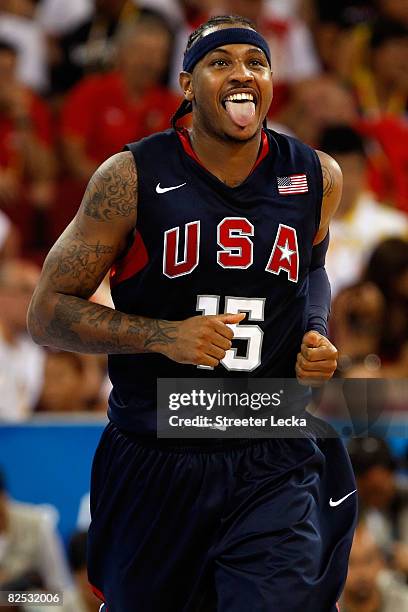 Carmelo Anthony of the United States sticks out his tongue as he runs down court during the gold medal game against Spain during Day 16 of the...