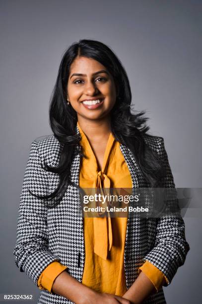 portrait of young guyanese woman - yellow blazer stock pictures, royalty-free photos & images