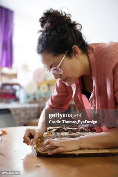 mature craftswoman measuring chair for reupholstering - renovation of upholstered furniture stock pictures, royalty-free photos & images