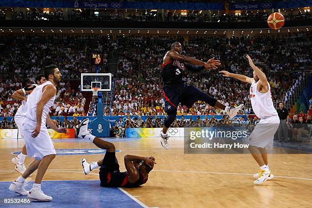 Dwyane Wade of the United States passes the ball over Jorge Joaquin Garbajosa of Spain in the gold medal game during Day 16 of the Beijing 2008...