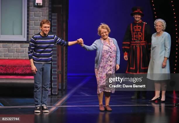 Cast members Ashley Cousins and Gilly Tompkins bow at the curtain call as Richard James and Louise Bailey look on during the press night performance...