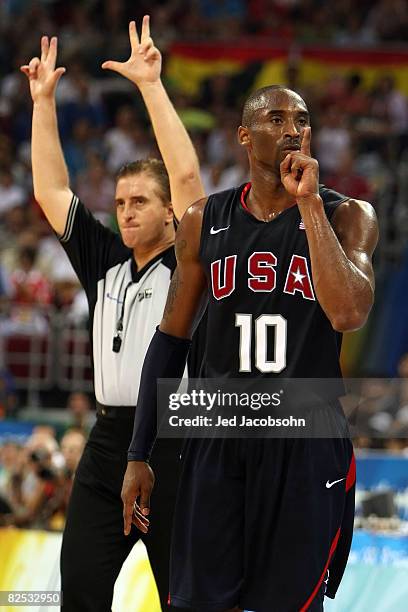 Kobe Bryant of the United States reacts after making a three point shot and drawing a foul in the fourth quarter of the gold medal game against Spain...