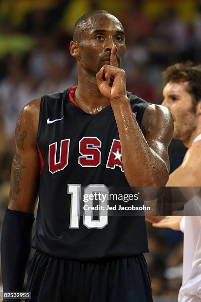 Kobe Bryant of the United States reacts after making a three point shot and drawing a foul in the fourth quarter of the gold medal game against Spain...