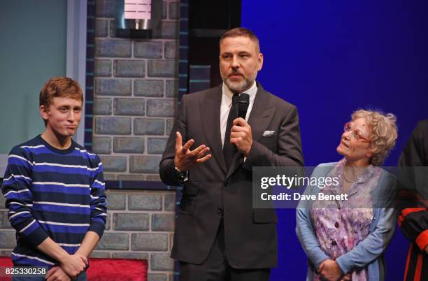 David Walliams speaks at cast members Ashley Cousins and Gilly Tompkins look on at the curtain call during the press night performance of "David...