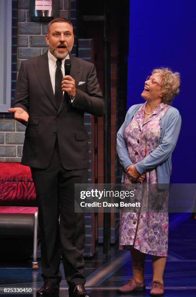 David Walliams speaks as cast member Gilly Tompkins looks on at the curtain call during the press night performance of "David Walliams' Gangsta...