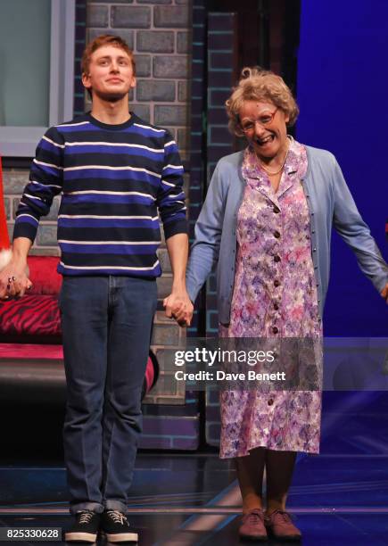 Cast members Ashley Cousins and Gilly Tompkins bow at the curtain call during the press night performance of "David Walliams' Gangsta Granny" at The...