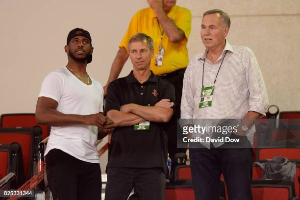 Chris Paul, Jeff Bzdelik and Mike D'Antoni of the Houston Rockets are seen at the game between the Houston Rockets and the Cleveland Cavaliers during...