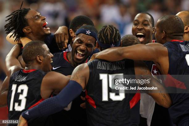 LeBron James of the United States celebrates with his teammates after defeating Spain 118-107 in the gold medal game during Day 16 of the Beijing...