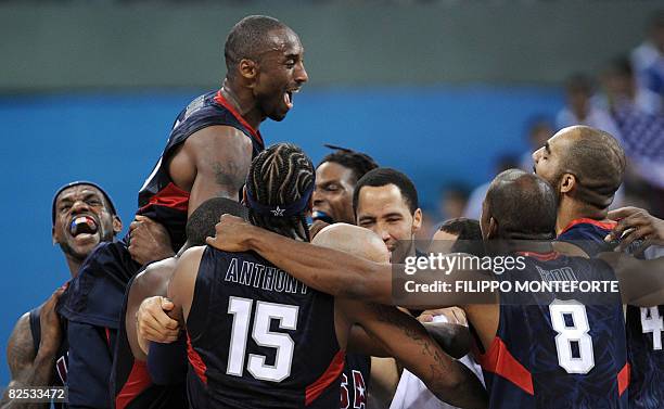 S Kobe Bryant celebrates with teammates at the end of the men's basketball gold medal match Spain against The US of the Beijing 2008 Olympic Games on...