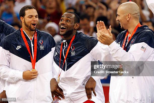 Deron Williams, LeBron James and Jason Kidd of the United States share a laugh during the medal ceremony after defeating Spain 118-107 in the gold...