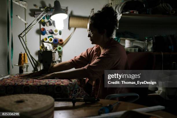 craftswoman working late - renovation of upholstered furniture stock pictures, royalty-free photos & images