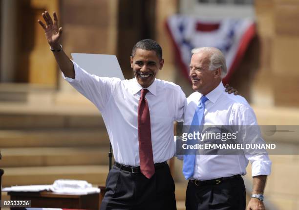 Democratic presidential candidate Illinois Senator Barack Obama and running mate Delaware Senator Joe Biden wave during a rally in Springfield,...