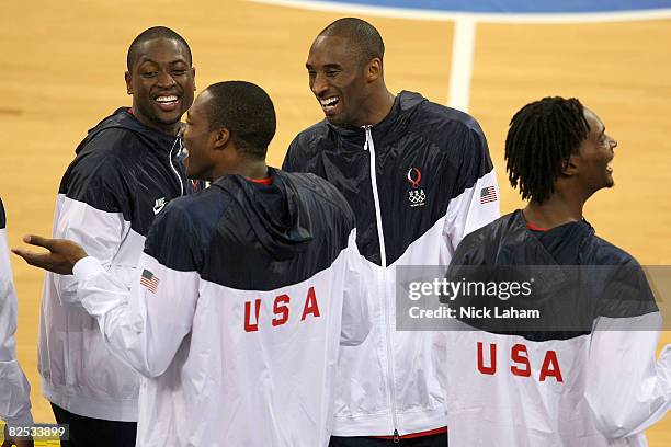 Dwyane Wade, Dwight Howard, Kobe Bryant and Chris Bosh of the United States share a laugh before receiving the gold medal in the medal ceremony for...