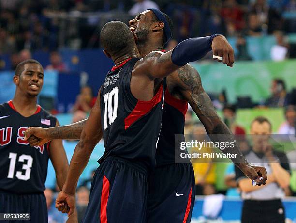 LeBron James Kobe Bryant and Chris Paul of the United States celebrate after defeating Spain 118-107 in the gold medal game during Day 16 of the...