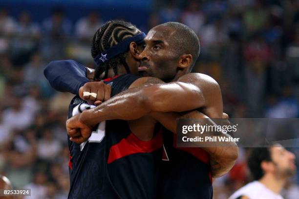 Kobe Bryant and Carmelo Anthony of the United States embrace after defeating Spain 118-107 in the gold medal game during Day 16 of the Beijing 2008...