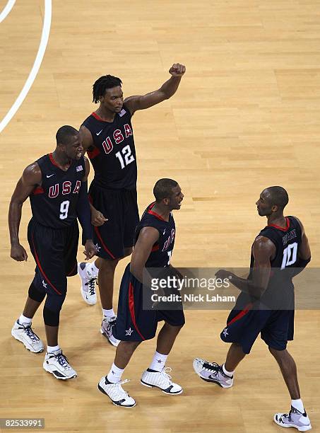 Dwyane Wade, Chris Bosh and Chris Paul celebrate with Kobe Bryant of the United States after Bryant made a three point shot in the gold medal game...