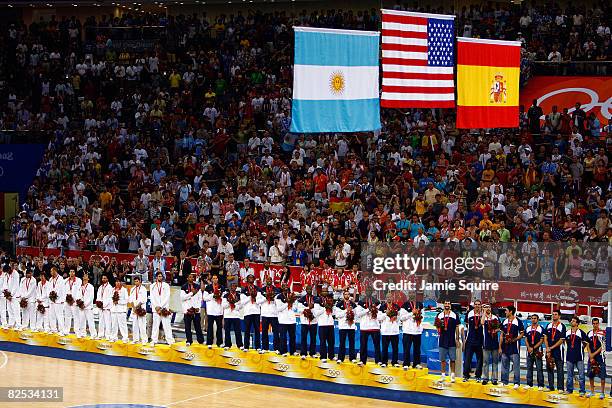 Silver medal winners Spain, gold medal winners United States and bronze medal winners Argentina stand on the podium during the medal ceremony for the...