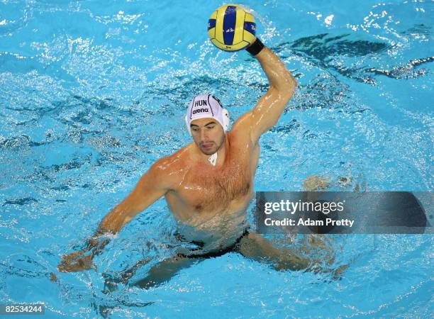 Tibor Benedek of Hungary controls the ball against the United States during the Men's Gold Medal Water Polo Match at the Yingdong Natatorium of...