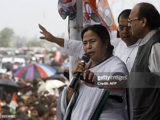 Leader of India's Trinamool Congress party, Mamata Banerjee , accompanied by Swamajvadi Party leader Amar Singh , adresses the gathering at a...