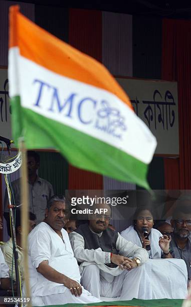 Leader of India's Trinamool Congress party Mamata Banerjee addresses a gathering, accompanied by Swamajvadi Party leader Amar Singh and former...