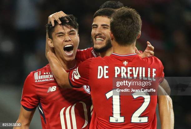 Yassine Benzia of Lille celebrates his goal with Luiz Araujo and Nicolas De Preville during the pre-season friendly match between Lille OSC and Stade...