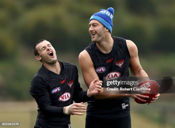 Brent Stanton and Tom Bellchambers of Bombers fool around during an Essendon Bombers AFL training session at the Essendon Bombers Club on August 2,...