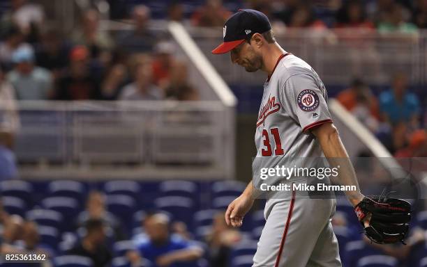 Max Scherzer of the Washington Nationals reacts after taking himself out of the game in the second inning with neck spasms during a game against the...