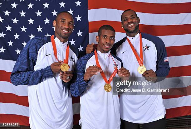 Kobe Bryant, Chris Paul and LeBron James of the U.S. Men's Senior National Team poses for portraits after defeating Spain 118-107 in the men's gold...