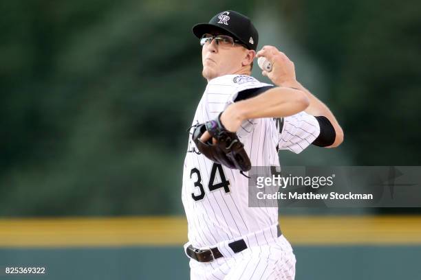 Starting pitcher Jeff Hoffman of the Colorado Rockies theows in the first inning against the New York Mets at Coors Field on August 1, 2017 in...