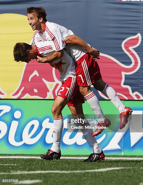 Mike Magee of the New York Red Bulls celebrates his goal in the 60th minute with teammate Andrew Boyens at Giants Stadium in the Meadowlands on...