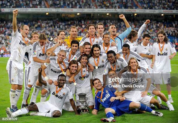 Real Madrid celebrate with their medals after beating Valencia in the Super Copa Second Leg match between Real Madrid and Valencia at the Santiago...