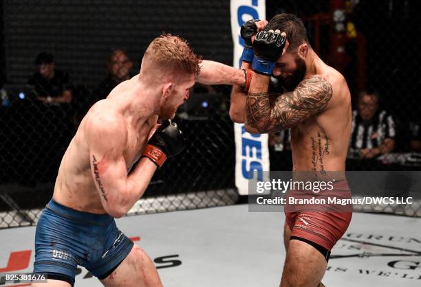 Austin Arnett punches Brandon Davisin their featherweight bout during Dana White's Tuesday Night Contender Series at the TUF Gym on August 1, 2017 in...